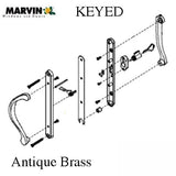 Marvin Active Keyed, Narrow Sliding Door Handle, Center Thumb - Antique Brass