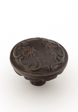 Schaub Cantata Round Knob - Scrolled designs with Petals on base in Dark Glazed Finish