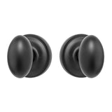 EAH111110B Rockwell Premium Solid Brass Helmsley Oval Knob Passage Set in Antique Black with Concealed Screws